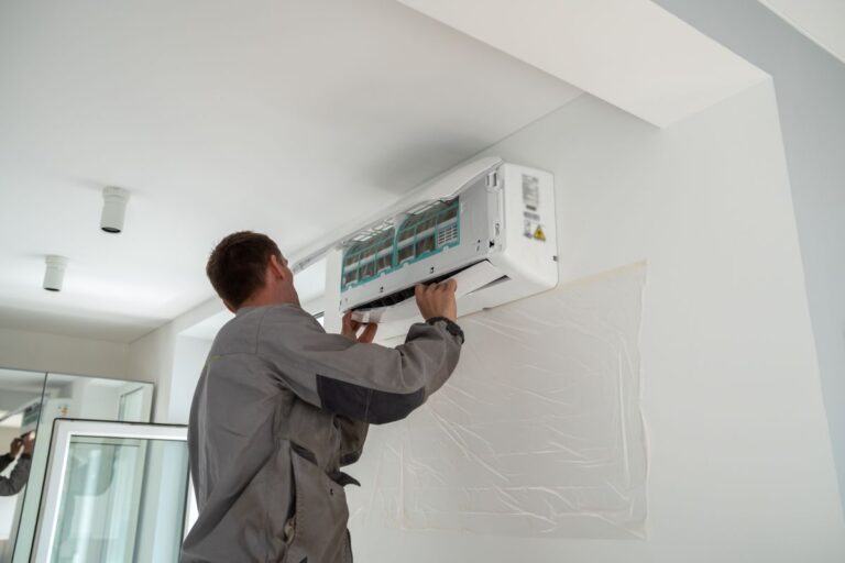 ac installation wildwood fl worker installing white unit