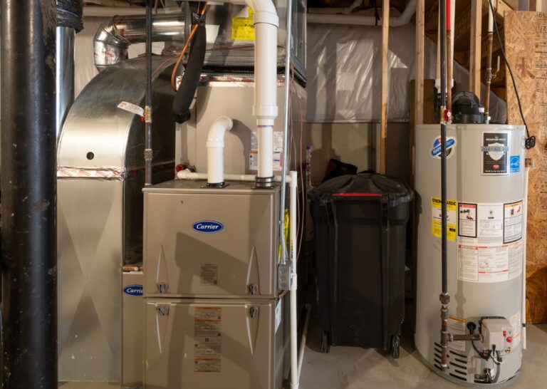 furnace tune up unit in the basement next to water tank