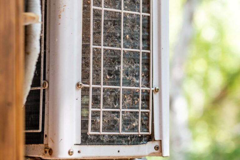 outdoor ac unit not turning on close-up outdoor air condition unit with clogged obstructed dirt and leaves compressor radiator grill