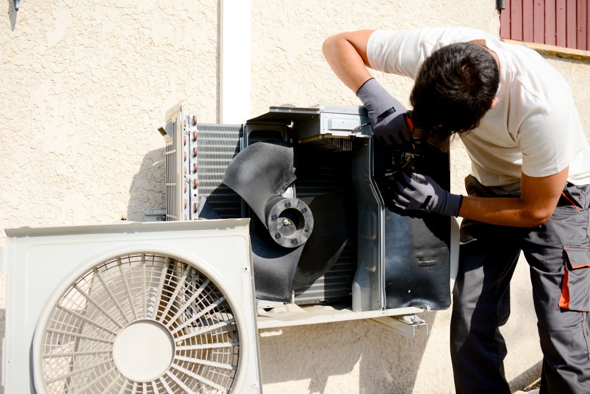 outdoor ac unit not turning on young worker using white clothes repairing unit air conditioner home