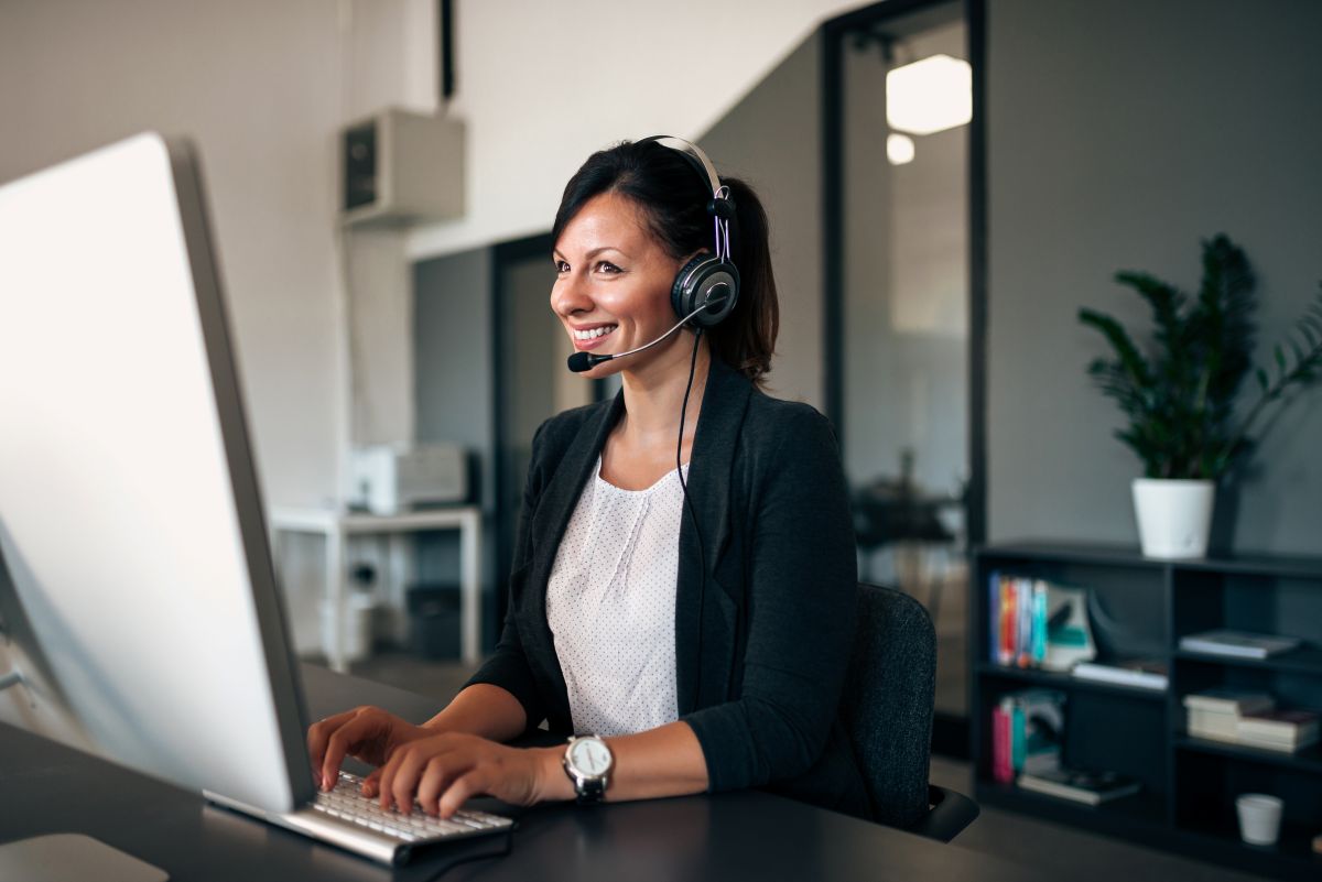 receptionist talking with client smiling