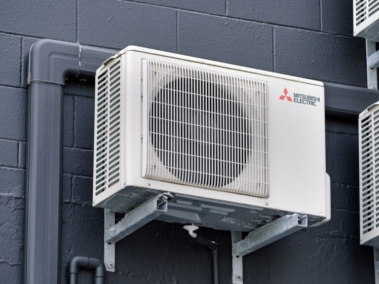 Mitsubishi Electric Air Conditioning Unit Mounted at Dark Wall