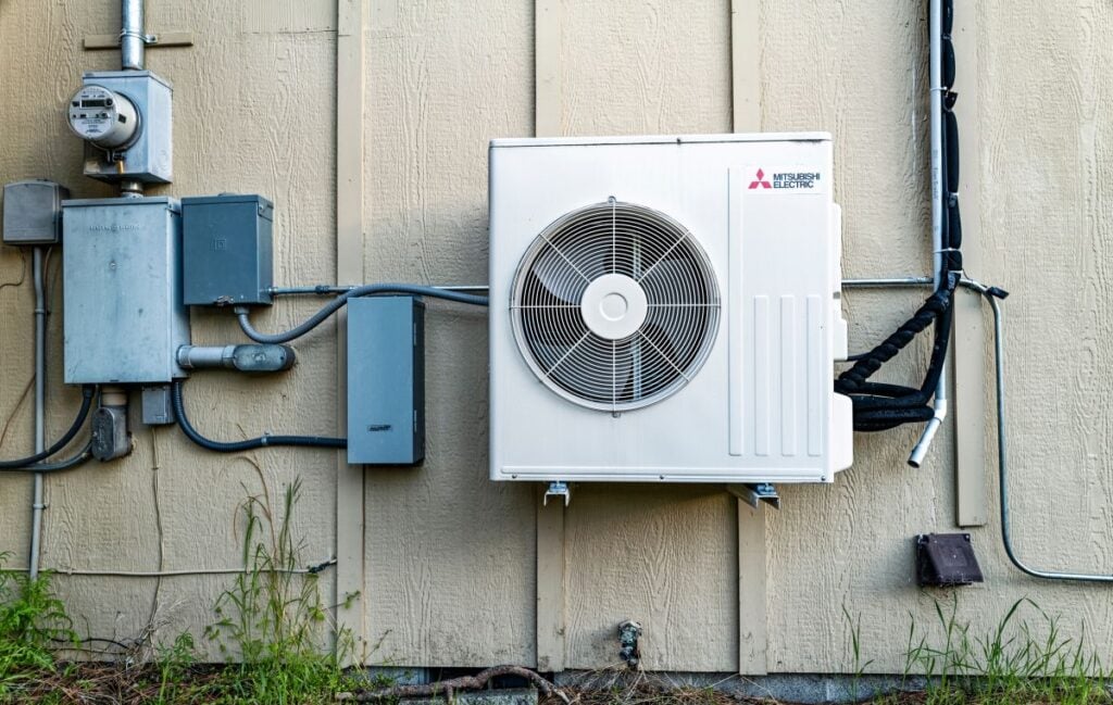 Mitsubishi air conditioner compressor fan installed on the exterior of a building